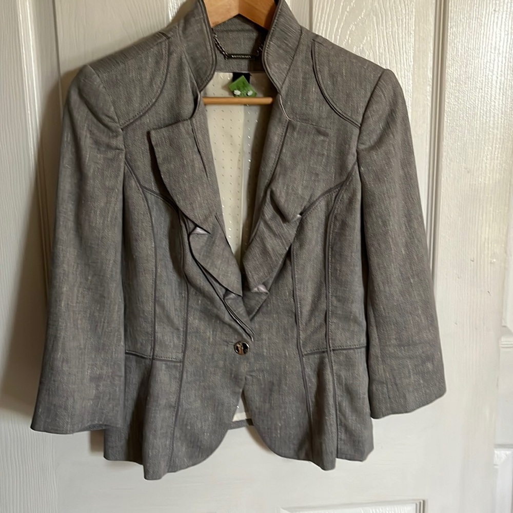 Gray jacket with ruffle detail. Three quarter sleeves WHBM size 4